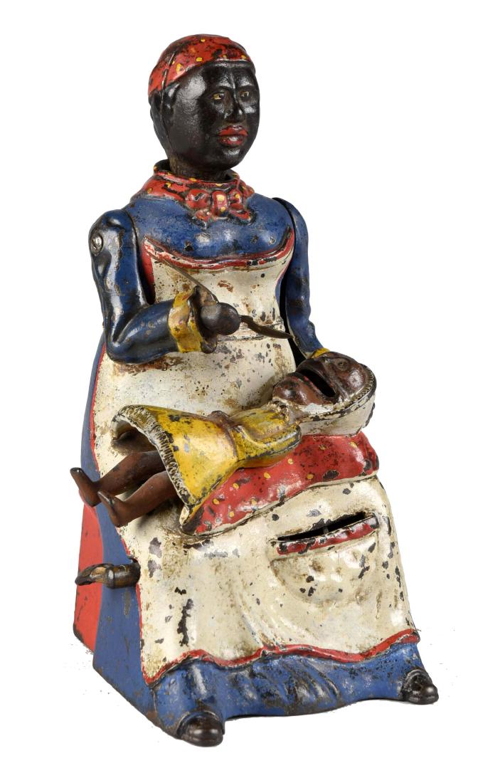 Kyser & Rex Cast Iron Mammy & Child Mechanical Bank.: Place a coin in the slot on Mammy's apron. Press the lever and mammy tilts her head and appears to be feeding the child as the child moves her legs. Spoon is embossed tin. There appears to be some ove
