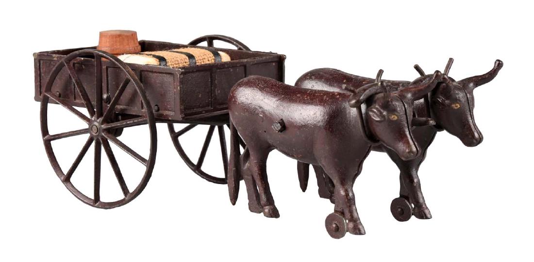 Rare Ives Two Oxen Drawn Cast Iron Cart. (1 of 2)