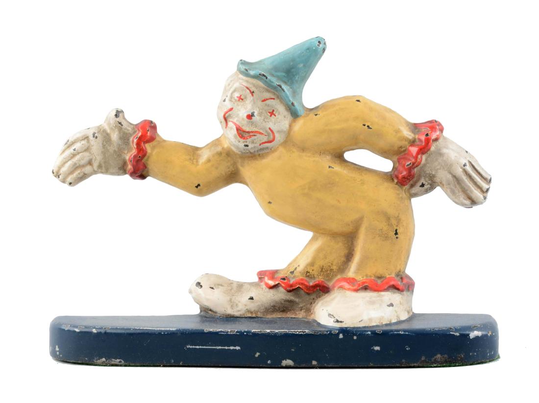 Cast Iron Clown With Arm Stretched Out Doorstop. (1 of 2)