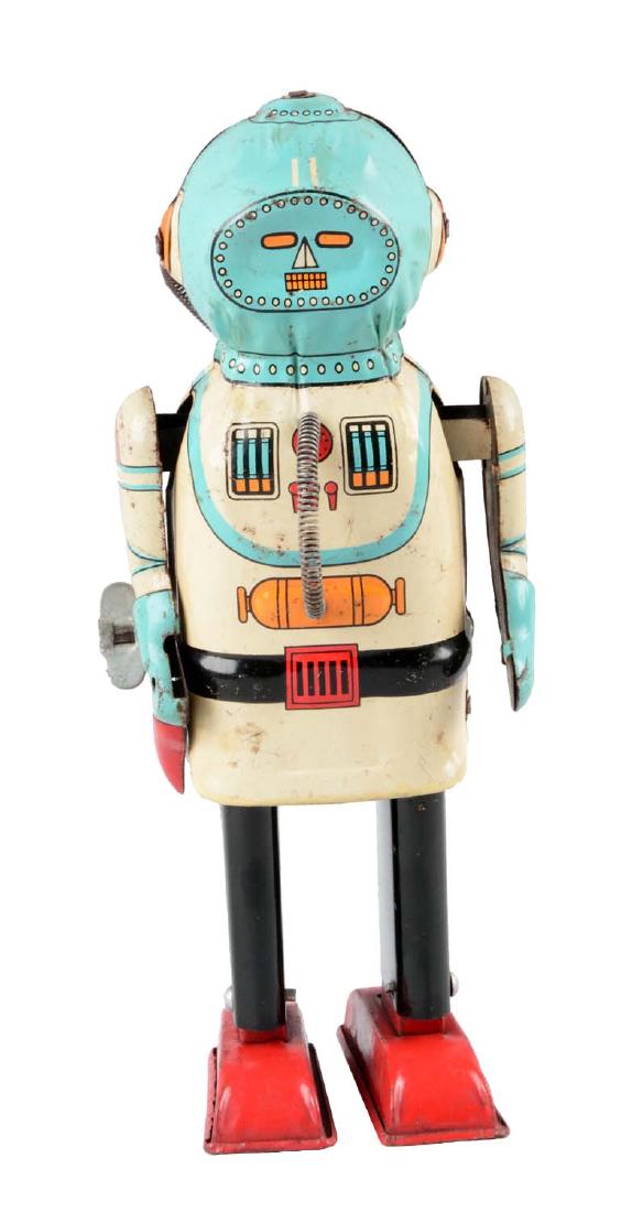 Japanese Tin Litho Wind Up Interplanet Space Captain.: Made by Naito Shoten. When wound robot walks forward and arms move back and forth. There is some moderate scratching and slight pitting through body and arms. Missing top of gun and paint touch up on 
