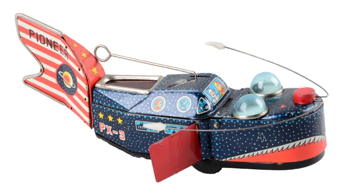 Japanese Tin Litho Wind-Up Pioneer Space Whale.: Unusual idea for a toy. Original metal side fins and antenna. Nice lithography. Made by KO Japan. Marked "PX-3" on sides and "Pioneer" on tail fin. Some scratching and spidering to litho throughout. (