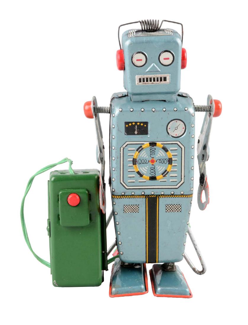 Japanese Tin Litho Battery Operated Easel Back Robot.: Made by Yonezawa. Remote control. Very difficult to find. Marked "Y" on back of the right leg. Looks to be all original including the correct remote. Some scratching and spidering to litho throughout.