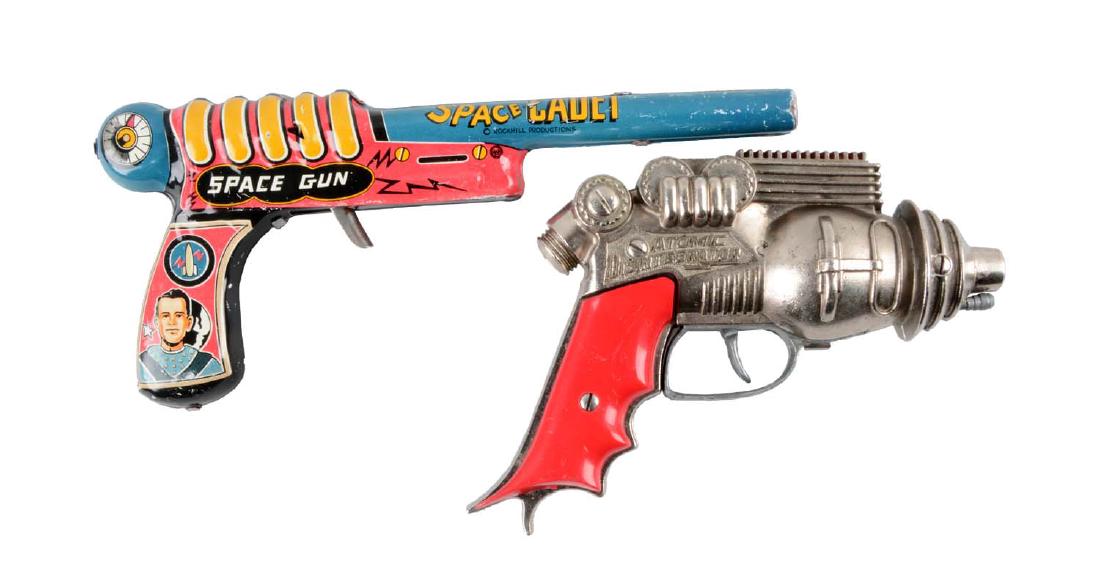 Lot Of 2: American Made Metal Space Guns.: The first one is a Marx tin litho Space Cadet clicker gun marked "Rockhill Productions". The second is a Hubley diecast Atomic Disintegrator pistol. Space Cadet gun does click when trigger is pulled.