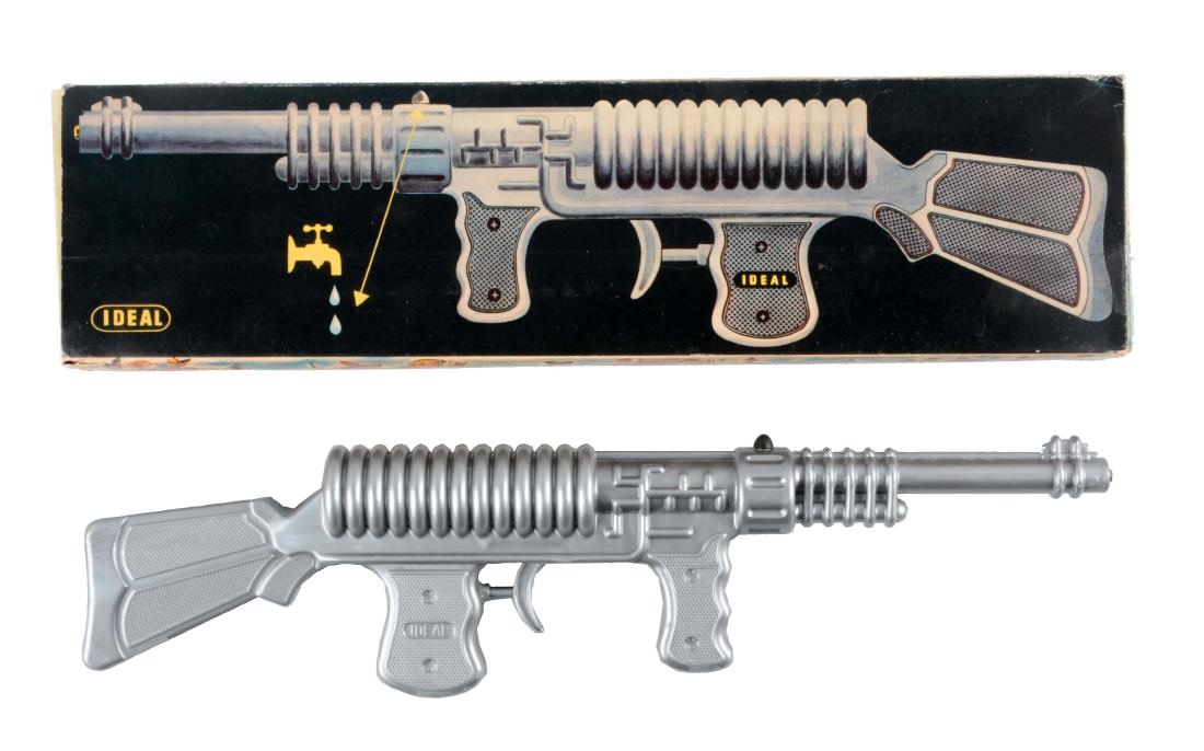 Ideal Plastic Water Squirting Ray Gun.: Includes crisp original box with beautiful graphics and insert. Marked "Ideal" on both sides behind trigger. Looks to be unused. Some edge wear to box. (Near Mint). Box : 20" x 5 -1/4".