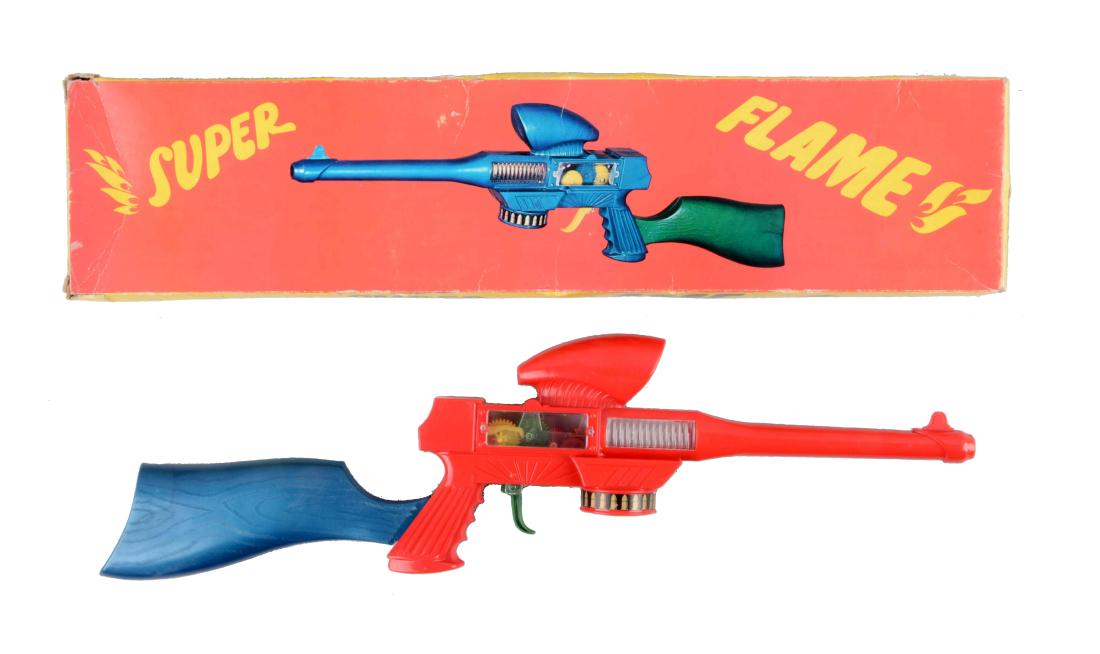 Plastic Greek Super Flame Space Rifle.: Includes colorful original box with Greek writing on end flaps. Nice picture of gun on box. Two-tone coloring, when trigger is squeezed gears inside move back and forth. Interesting style and shape. N