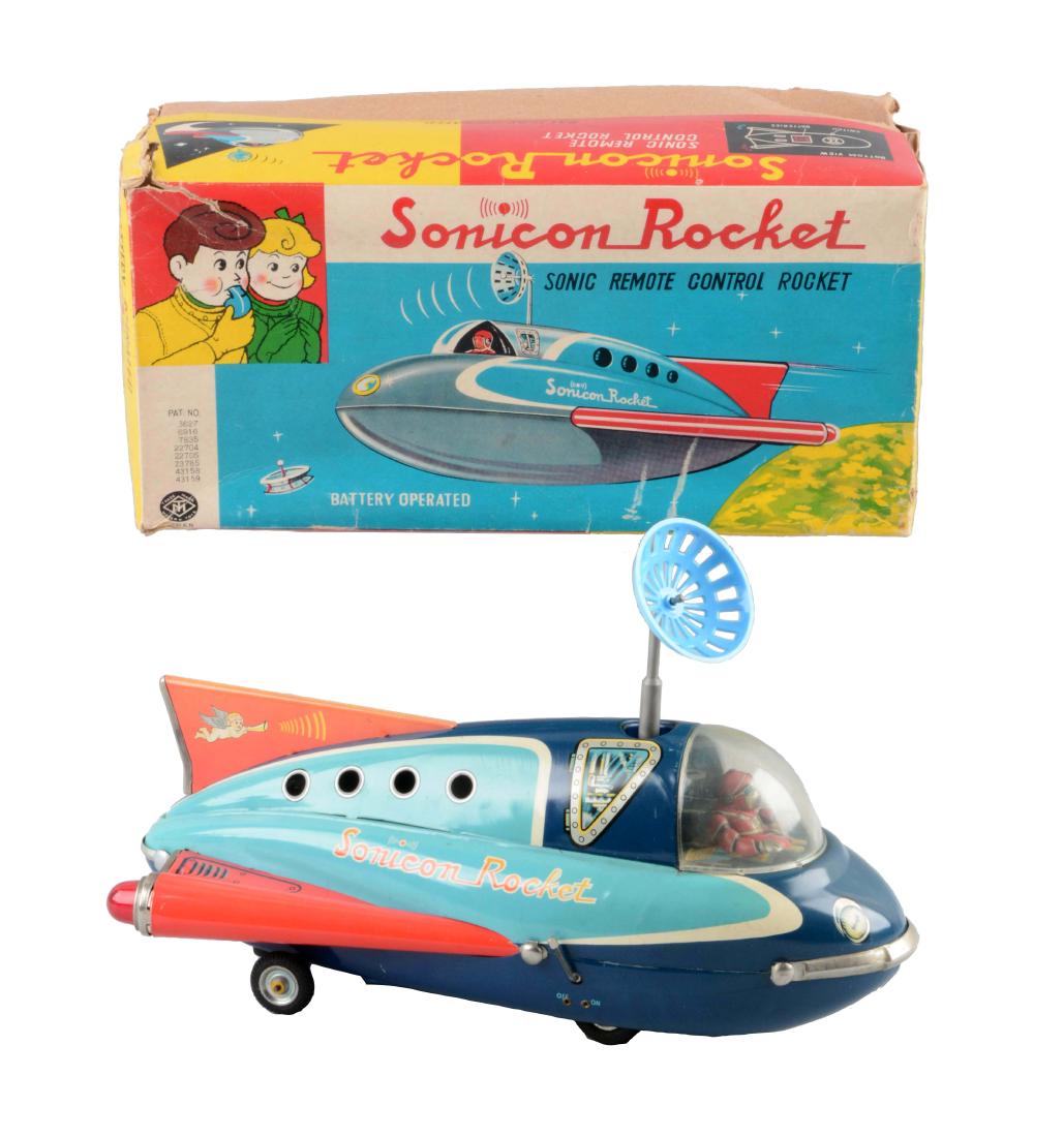 Japanese Tin Litho Battery-Operated Sonicon Rocket.: Includes original box. Made by Masudaya. When in operation spaceship travels forward and when whistle is blown, changes directions and antenna rotates. Has instruction sheet inside original box. Origi