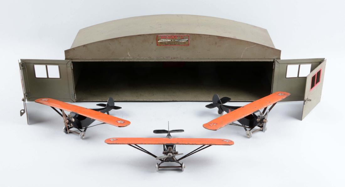 Press Steel Buddy L Hangar & 3 Monocoupe Planes. (1 of 2)