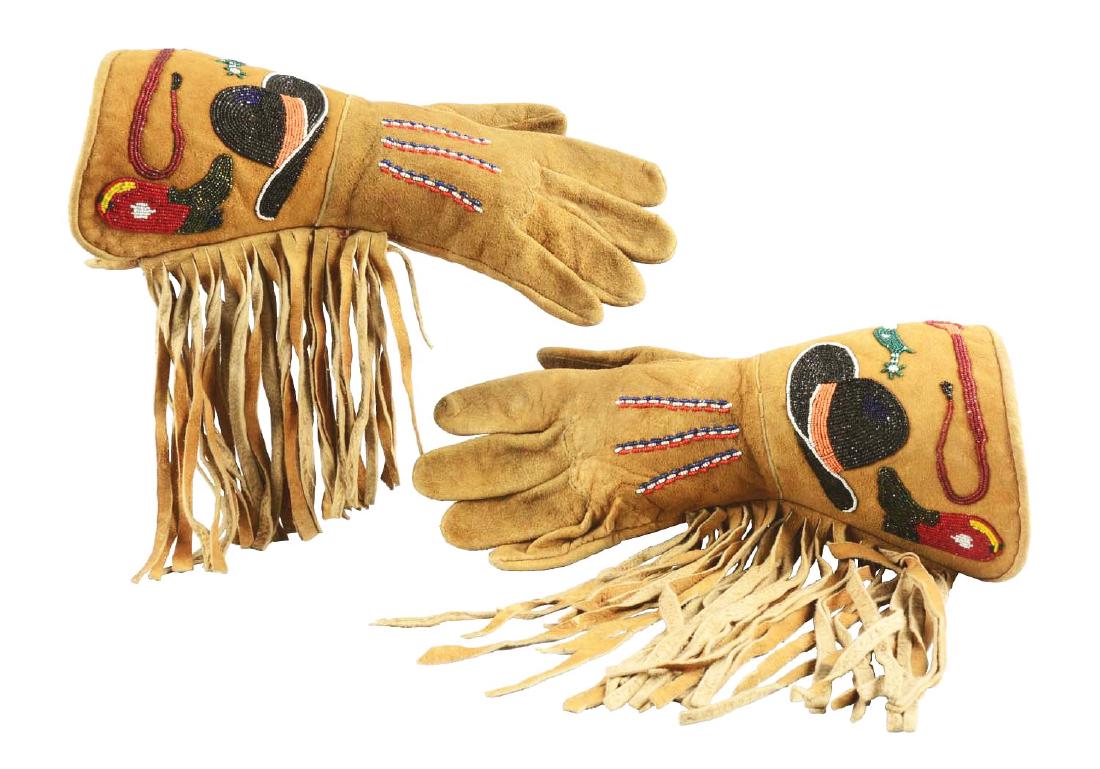 Unusual Plateau Pictorial Gauntlets.: With cowboy hat, cowboy boot, spur and riding quirt deisgns. Beaded on moose hide with cut beads. Circa 1930. Dimensions: 12-1/4" L.
