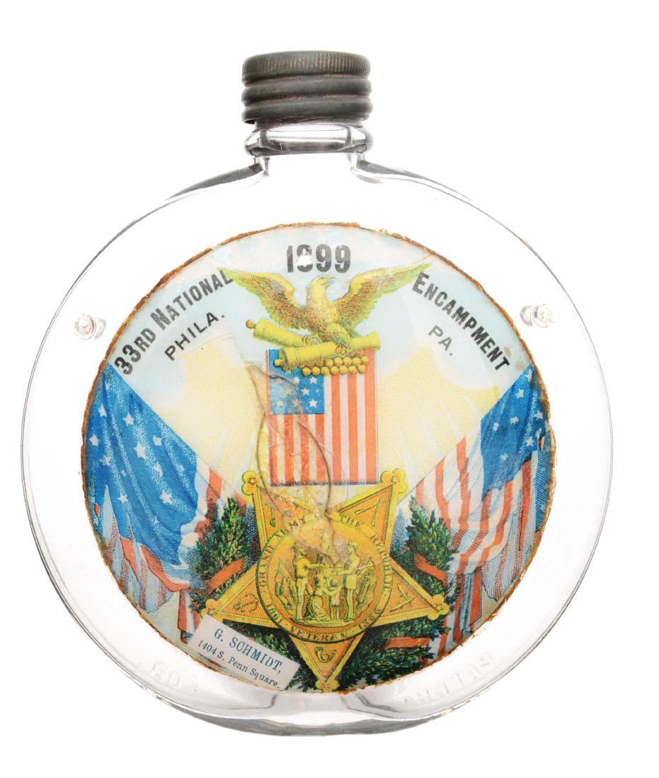 33rd National Encampment Glass Canteen Flask.: Round glass flask with metal lid and label under glass. The label reads "33rd National Encampment/ Phila. PA. 1899/ G. Schmidt 1404 S. Penn Square". The star reads "Veteran Grand Army of the Republic 