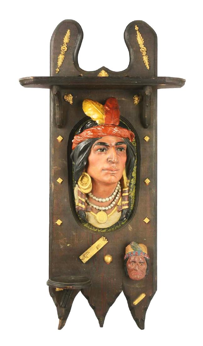Circa 1900-1910 Cigar Store Indian Wall Hanging Tobacco: Outstanding piece featuring Indian faces, brass filigree and a wood shelf. There are a couple of small chips on the top of the humidor lid and a couple of removed brass tacks from the top of no concer