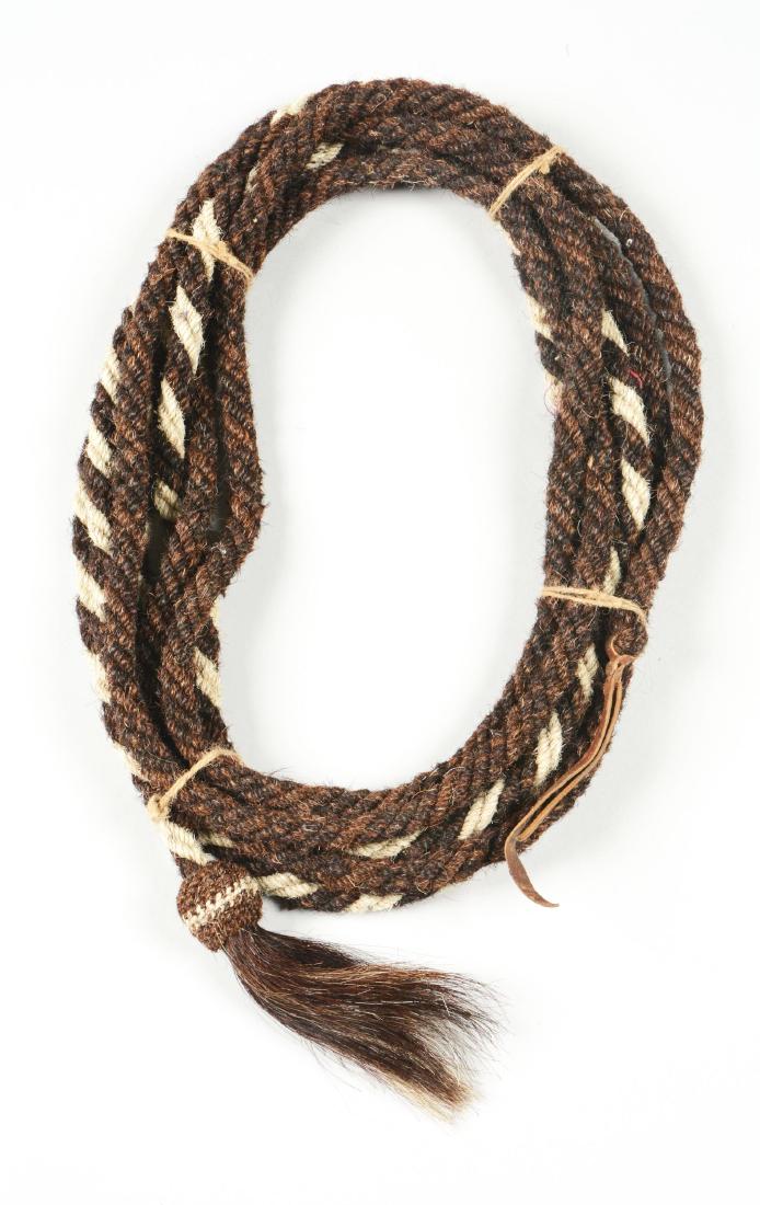 Varied Brown And White Designed Horsehair Mecate.: Very nice 23 foot braided horsehair rope mecate. Colors are in mixed fashion of solid brown with brown and white candy cane striping on the other half.Dimensions: 18" W. x 6" D.
