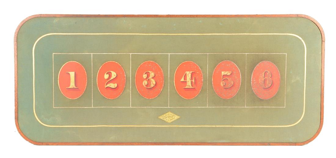 Chuck-A-Luck Layout.: This green felt layout has a wooden frame, gold border, and 6 red ovals. Written in a gold diamond is "H.C. Evans & Co. / Chicago / Ill. / 1522-28. W. Adams." handwritten in black ink. There are now e