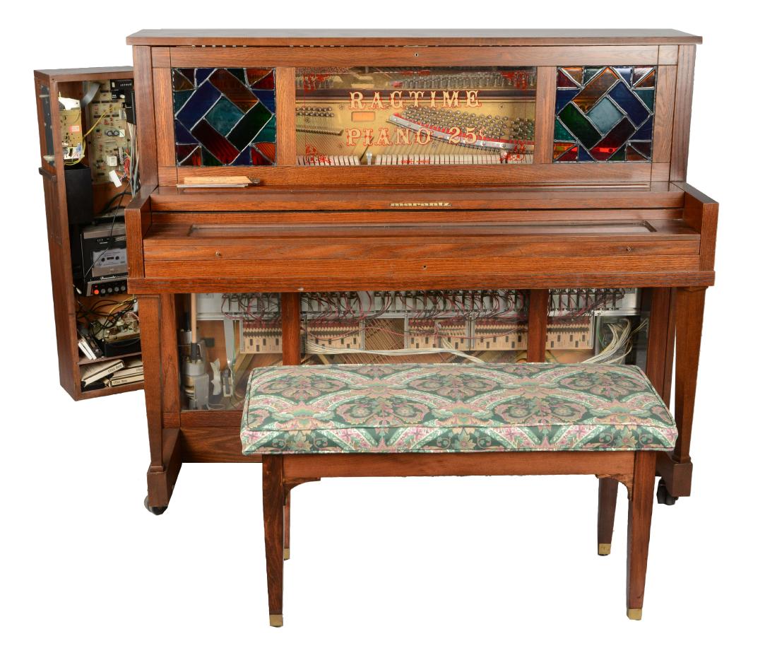 Lot Of 3: Marantz 25¢ Pianocorder Ragtime Player Piano: Ragtime player piano from Superscope, Inc. circa 1982. This piano has two lovely stained glass accent windows and a keyboard cover with clear glass panel for viewing the keys. The side coin mechanism 