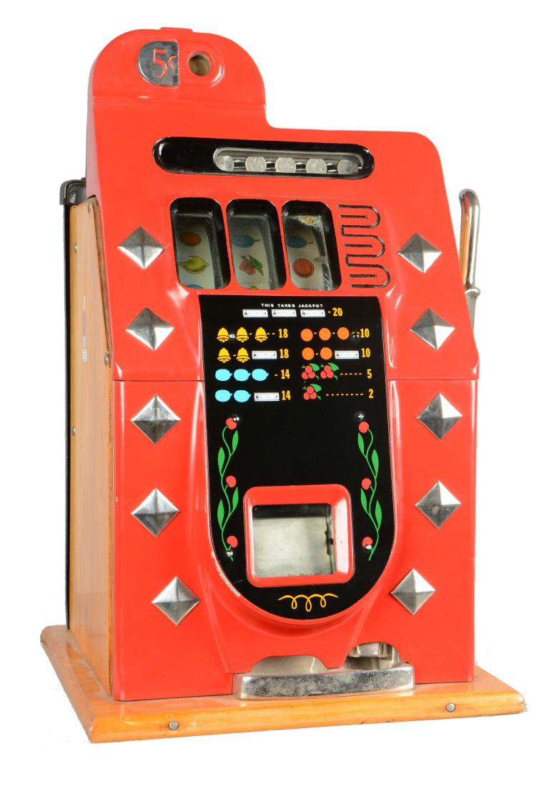 **5¢ Mills Novelty Chrome Mystery Diamond Front Slot: This example has replacement reel strips, cash box, back bonnet, and award marquee. Showing a small crack on the bottom back right side of the cabinet. In working condition. Circa 1939. Includes one k