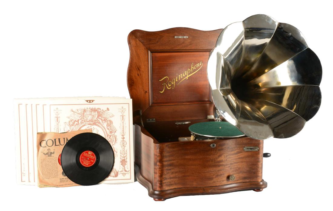 Reginaphone Music Box With Tune Sheets & Phonographs.: This remarkable music box is a Model 150. With a short bed plate, plays 15-1/2" tune sheet discs, serpentine mahogany cabinet, and dual combs. This model also plays 78 rpm phonographs. Included are a