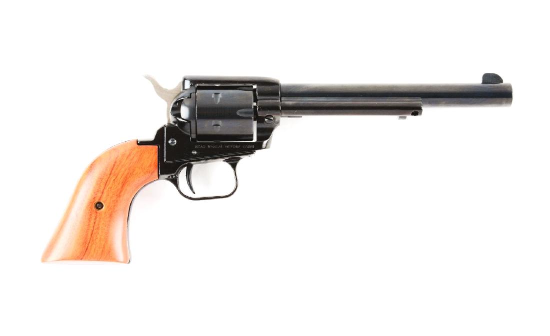 (M) Boxed NRA Heritage Firearms Rough Rider Revolver.: Features six shot, single action, blued finish, two piece wood grips with special NRA logo on left grip panel. Gun is unfired in the original box with paperwork and tools. Manufacturer: Heritage Manuf