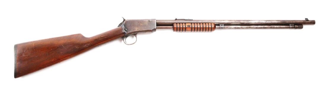 (C) Winchester Model 06 Pump Action Rifle.: Post-1934 parts gun. Features round barrel, magazine fed, sporting sights, grooved walnut forend, walnut buttstock, black composite buttplate, and takedown. Frame retains approximately 10% original bl