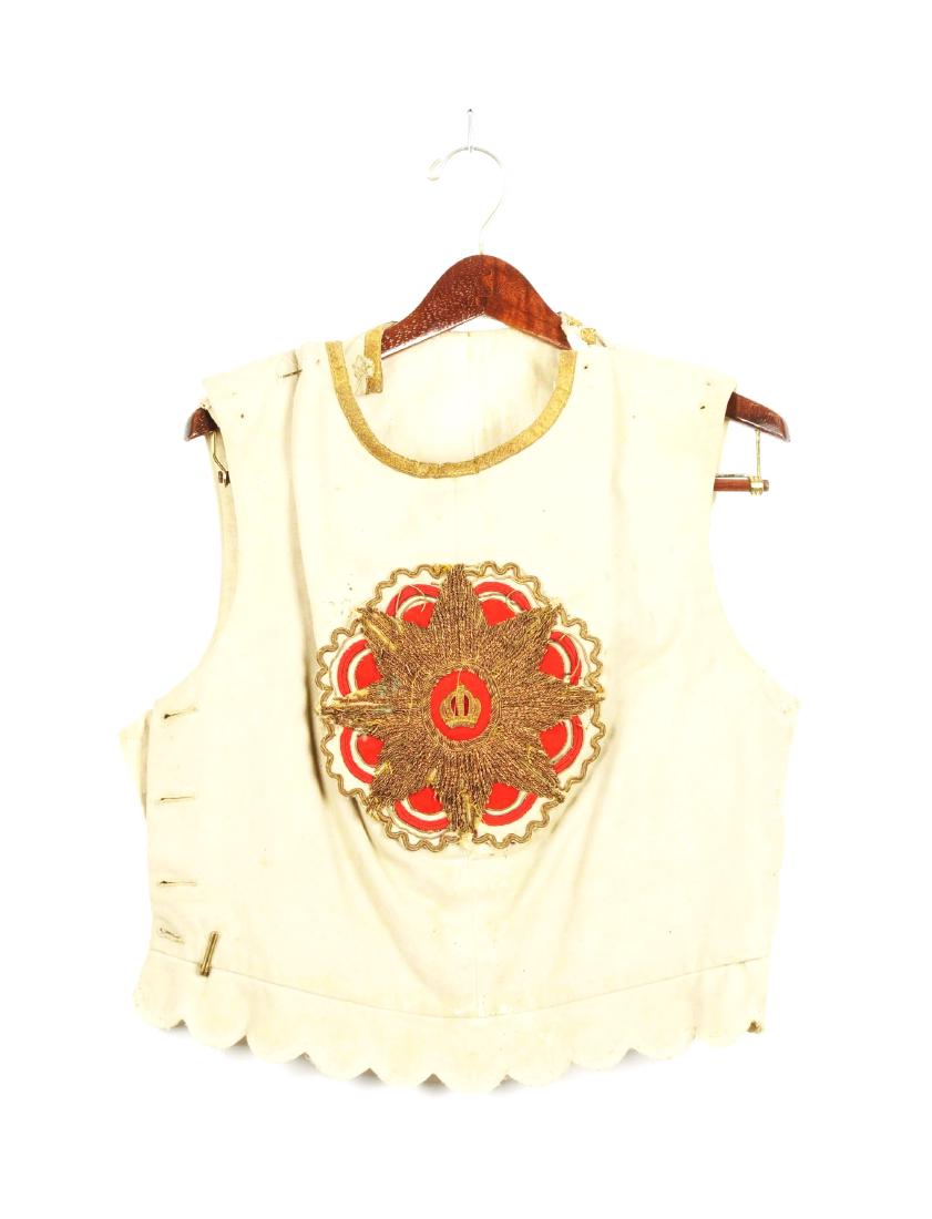 Russian Parade Supervest.: Early 20th century. White wool with white cotton lining. Gold lace edging neck hole, central device on breast consisting of eight pointed star and crown in center on red background. Four button hole c