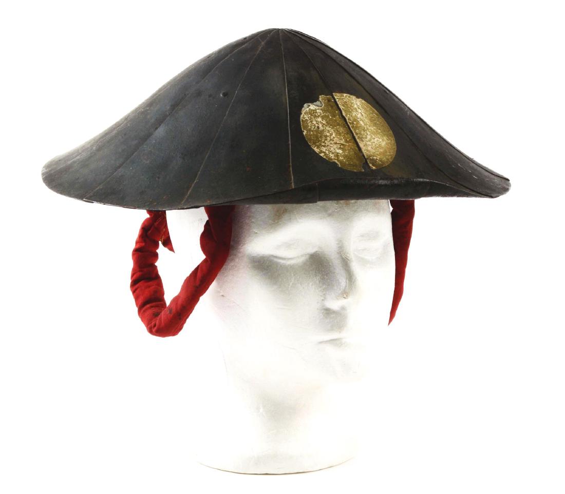 Rare Myochin School Japanese Jingasa.: Of fourteen riveted iron plates. Helmet retains its original lining and straps. Decorated with a single silver mon. In good condition overall and most attractive. Manufacturer: , Model: , Serial Numbe
