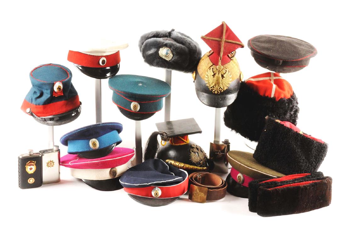 Large Lot Of Russian Hats & Head Gear.: Hats and helmets of various styles, colors and time periods. Includes a Russian belt and several Russian flasks. Conditions vary from excellent and showing little to no use, to fair and showing heavy 