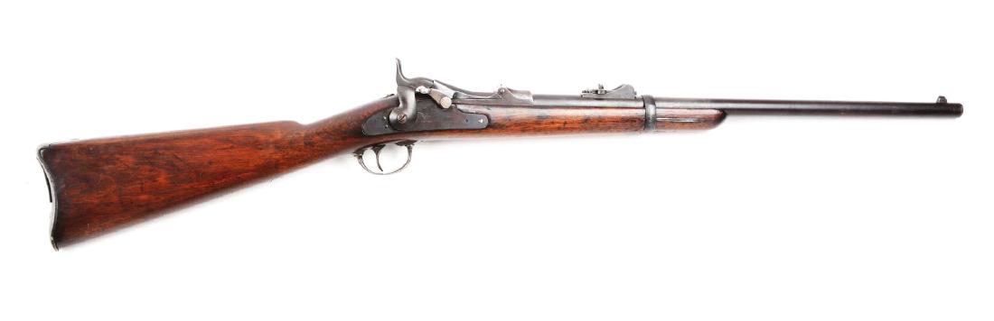 (A) U.S. Springfield Model 1873 Trapdoor Carbine.: This is a standard U.S. issue Saddle Ring Carbine from the Indian Wars period. Standard 1873 carbine stamped rear sight, original saddle ring bar and ring, single band. Block is stamped â€œU.S. / 