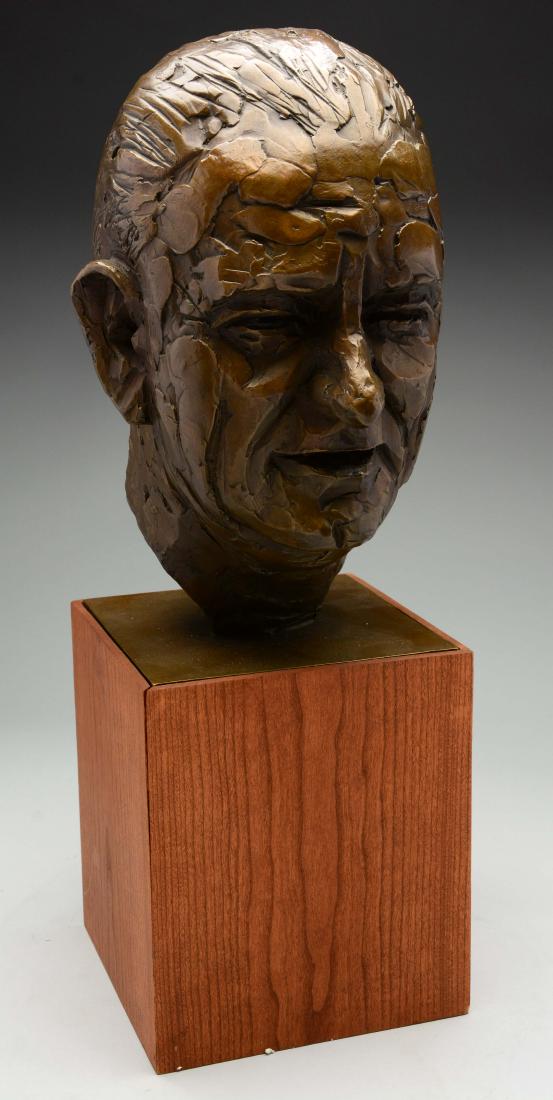 Bronze Bust of President Johnson.: This lot consists of a bronze bust of President Johnson. The artist has depicted the President with his mouth open, almost as if he was in the middle of a speech. On the back of the piece the artist h