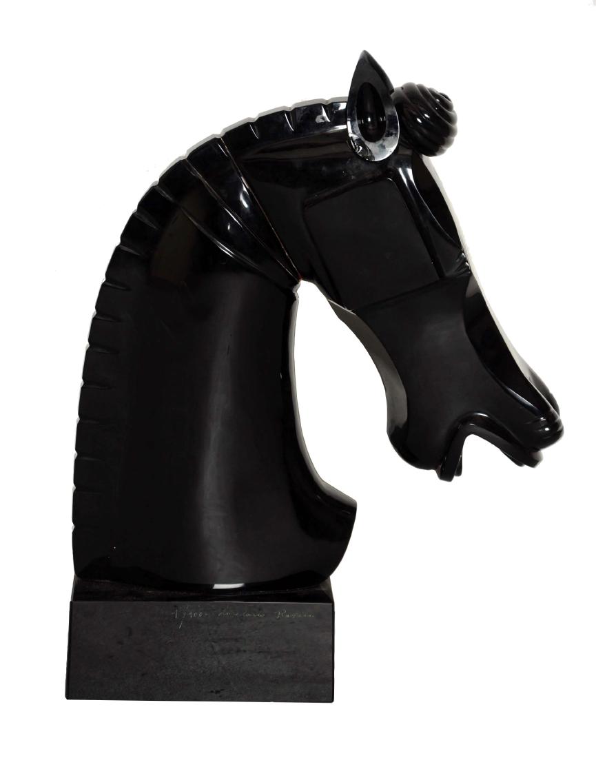 Black Murano Glass Horse Head.: This lot consists of a large beautiful black Murano horse head statue. One that is reminiscent of a chess piece, done in the art deco style with clean lines. The horse's head is situated on a black sq