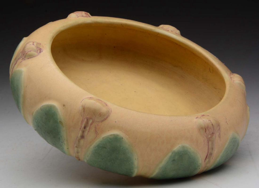 Hampshire Pottery Arts & Crafts Two-Color Bowl.: Very unusual colors with a leaf and bud design. Marked "Hampshire Pottery 57 M".Condition: Dimensions: 3" x 10".