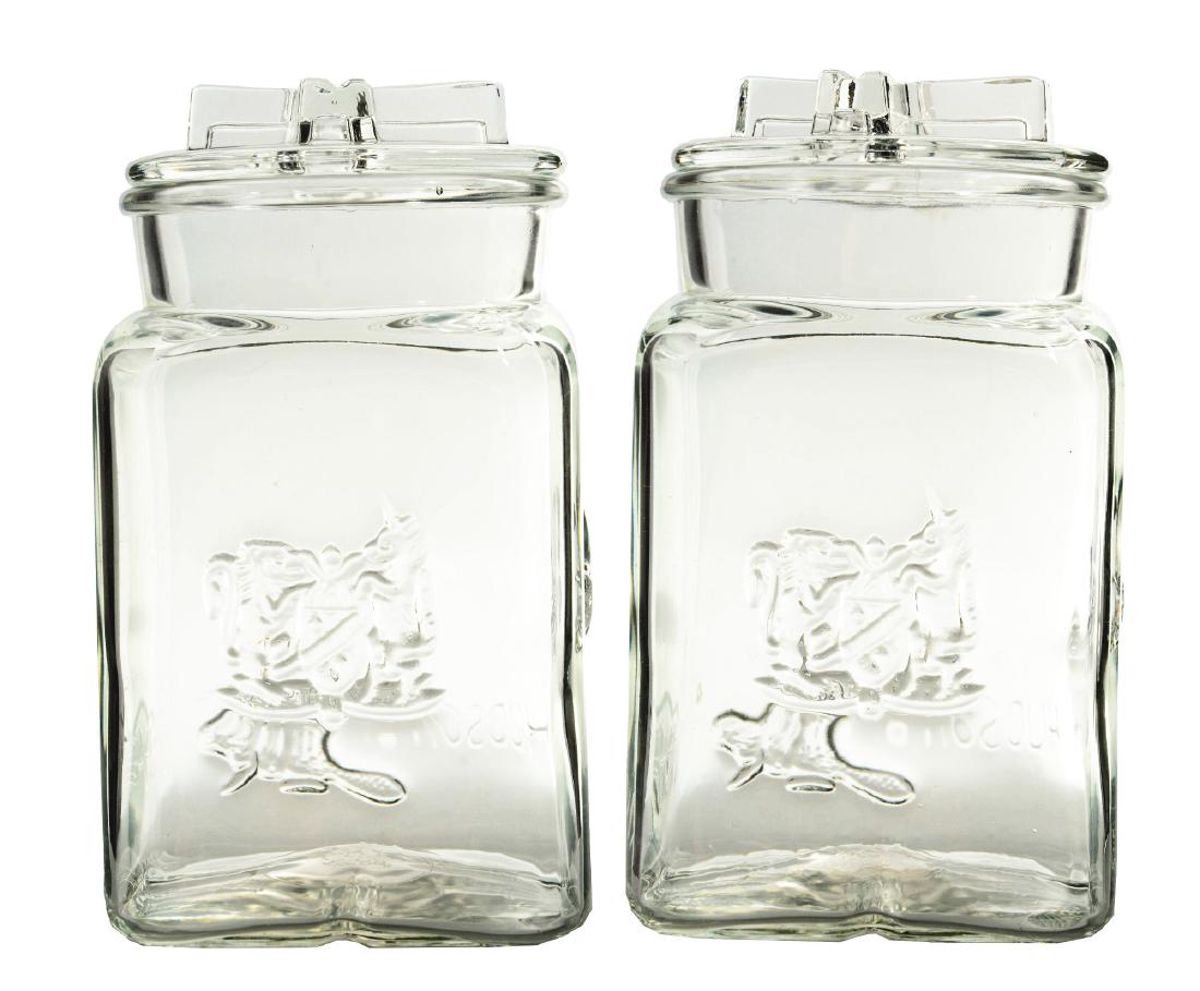 Lot of 2: Hudson Bay Glass Jars.: This is a nice lot of two matching Hudson Bay Jars. Hudson Bay is written on one side right next to an embossed beaver. Both jar lids have crosses designed into them. They are both in wonderful condit