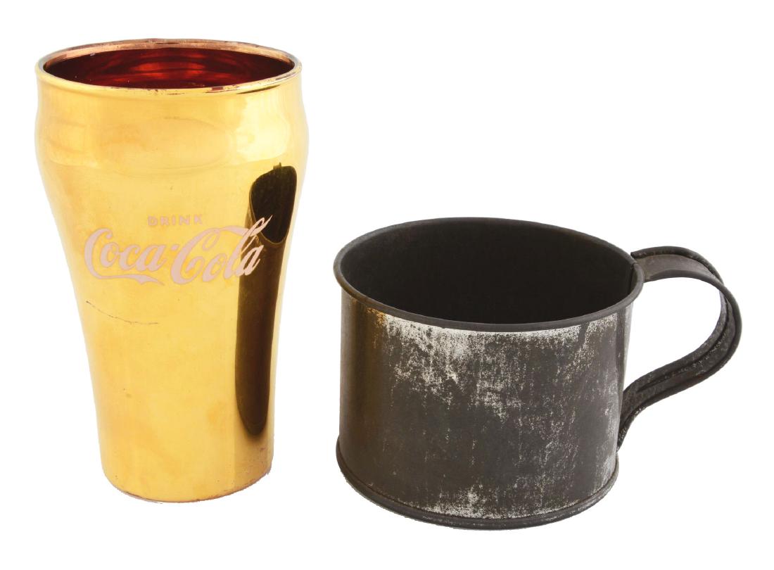 Lot Of 2: Coca-Cola Gold Cup & Tin Mug.: The tin cup is from the 1930's and has overall wear with a great print on the bottom which says "Use this cup for water but Drink Coca-Cola in Bottles". The gold cup is in excellent condition. Conditi