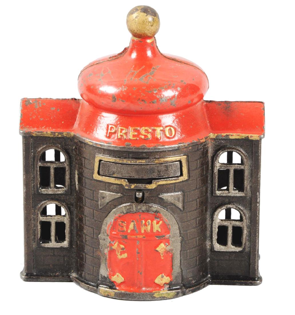 Kyser & Rex Cast Iron Presto Bank.: Excellent Highlights. Original trap with key. (JY).Condition:(Excellent Plus).Dimensions:3 - 3/4" x 4 - 1/2".