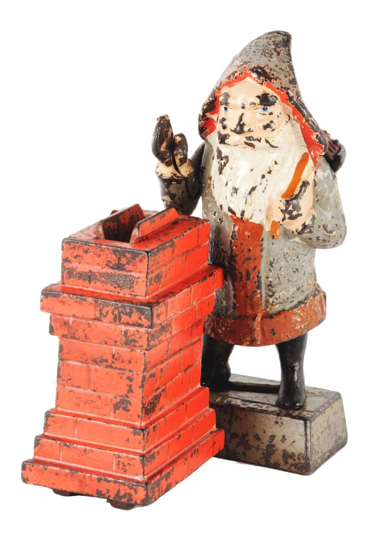 Shepard Hardware Santa Claus Cast Iron Mechanical Bank.: Place a coin in Santa's hand and press the lever. His hand lowers and drops the coin in the chimney. (JY). Condition:(Very Good - Excellent).Dimensions:4 - 1/4" x 6 - 1/4".