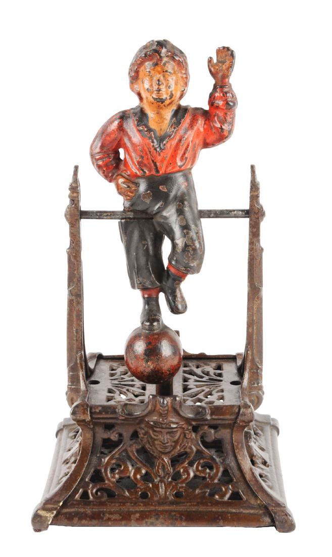 J. Barton Smith Boy on Trapeze Cast Iron Mechanical: Place a coin in the slot in the boy's head. He will do one revolution for a penny, two for a nickel, three for a quarter and six for a half dollar. (JY).Condition:(Very Good).Dimensions:9 - 1/2" x 5".