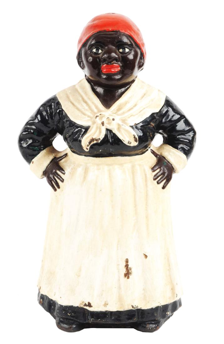 Cast Iron Mammy w/ Hands on Hips Doorstop.: Full-figure thin waist mammy wearing black dress. Numbered “45” on back of base. Difficult to find. Condition:(Very Good).Dimensions:10" x 6 - 1/4".