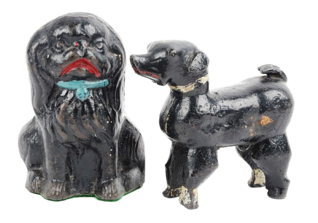 Cast Iron Assorted Dog Doorstops.: Includes sitting Pekingese that fits over edge of door. Book example; and stylized Terrier. Condition:Dimensions:3- 1/2" x 5 -1/2".
