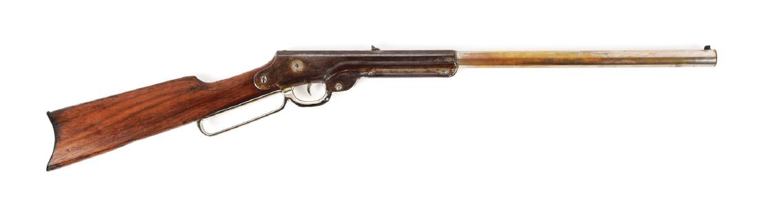 Daisy Bennett 1000 Shot Air Rifle: Barrel Length: 11". Mfg: 1903-09. BB/.175 cal. Retains 40-50% of original nickel finish. Stock has steel buttplate with heavy wear. Stock also has a large crack underneath. Stamped "1000 Shot Daisy" o