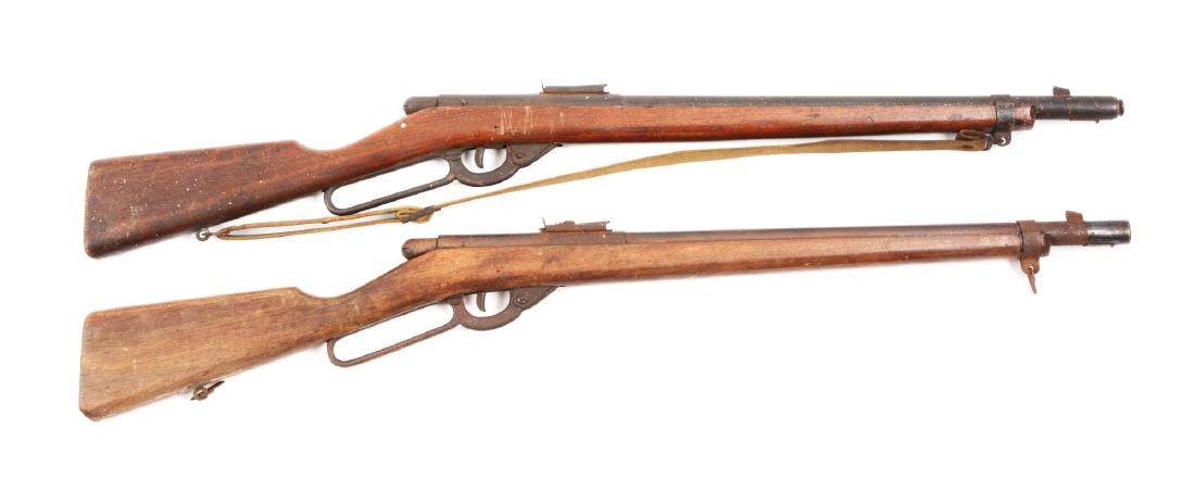 Lot Of 2: Daisy Model 40 Military Trainers.: (A) has rust on lever and barrel; very little bluing left. Front and rear sight are rusted. Wood has scratches and some carving. 40% overall. (B) is a Variant I with factory sling (previous owner's na