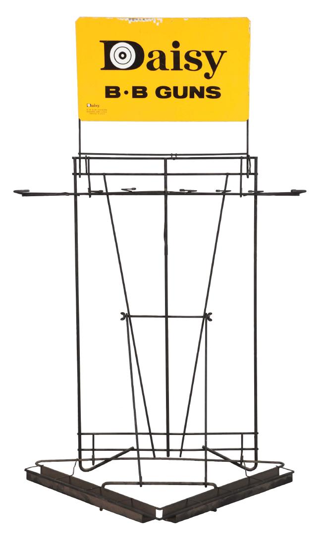 Daisy BB Gun Rack.: 15.5x28x45" wire floor display sales rack w/10x16.5" tin litho topper sign. Produced to display Daisy BB guns in hardware/toy stores, 1960s. Topper has large "Daisy B-B Guns" text, smaller "Daisy B-B