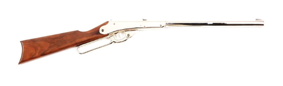 Daisy Model B 500 Shot Air Rifle: BB/.175 Caliber, Lever Action, Nickel finish with close to 100% of original finish remaining. Stock is in very good condition with only some minor marks on the rear edges. Fine Action. Caliber: BB/.17