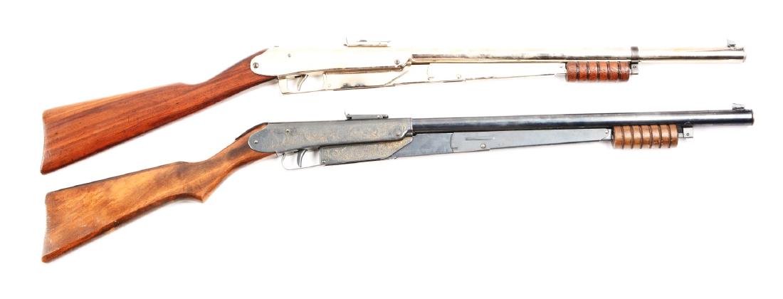 Lot Of 2: Daisy Model 25's.: (A) Stock has scratches and dents; good overall condition. Stock is loose. Front and rear sight are complete. Gun has been re-nickeled. Adjustable front sight. Large takedown screw. (B) Stock shows we