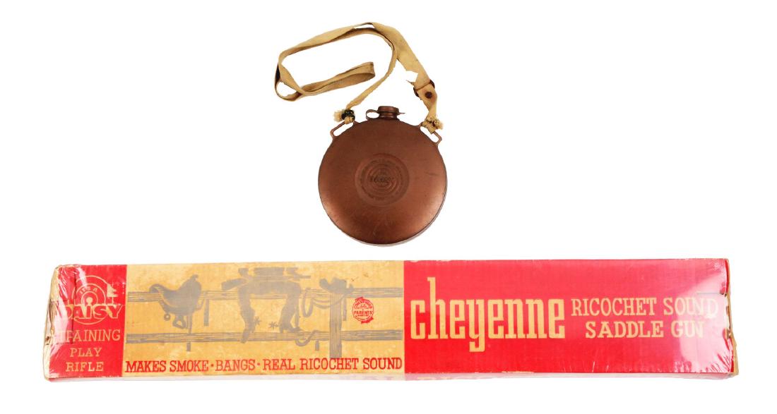 Lot of 2: Daisy Air Rifle Box & Canteen.: Box only for a Cheyenne Ricochet Sound Saddle Gun. Box has been enclosed in plastic to protect it. The other item is a plastic canteen with a compass on one side.Condition:(Very Good).Dimensions: