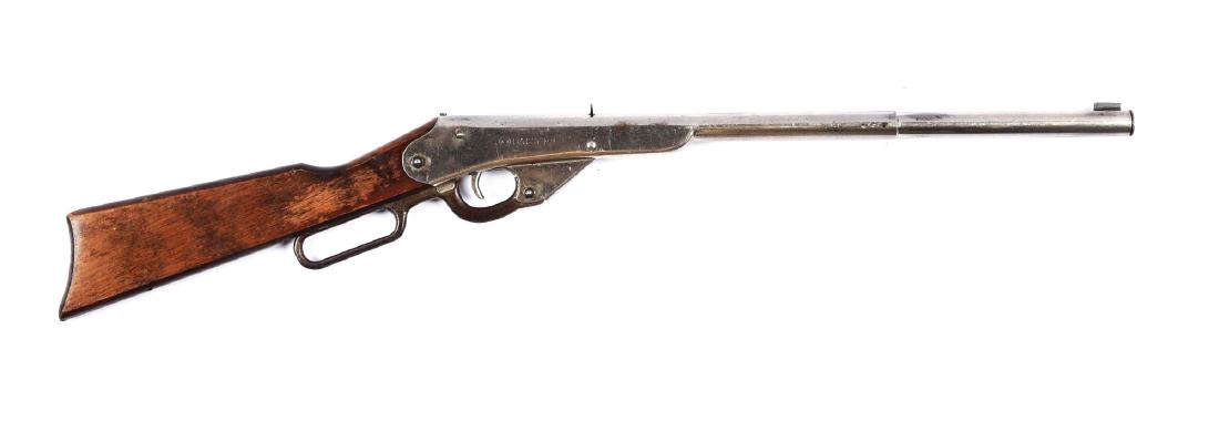 Daisy Model 29 No. 11 Air Rifle: Barrel: 8". Mfg: 1929-32. 350 shot. Has a nickel finish. Retains 70% of original finish. Lever has heavy wear. Finish worn off on stock where hand holds rifle. Also has several dings and some scratchi