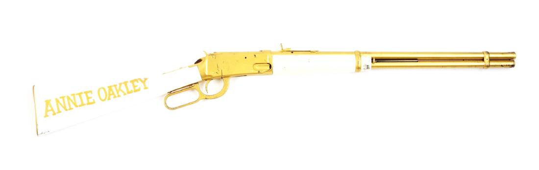 Daisy Model 1894 Air Rifle: This is a Daisy Model 1984 that has been fully repainted to look like an Annie Oakley commemorative air rifle. All metal has been painted gold and all wood has been painted white with "ANNIE OAKLEY" p