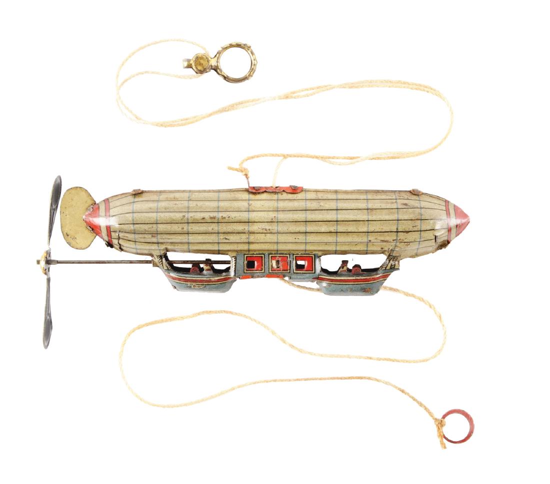 German Tin Litho Zepplin Penny Toy. (1 of 2)