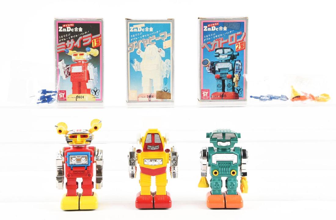 Lot of 3: ZNDc Robot Set.: Yonezawa. Each of these diecasts has a 1950's charm and are solidly executed in heavy diecast. The set of three are near new old stock with one damaged box. Condition:(Good - Near Mint).Dimensions: