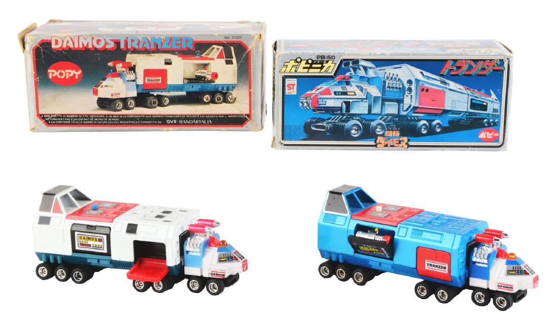 Lot of 2: Desirable Daimos Tranzer Toys PB-50 by Popy.: The Japanese Tranzer comes in white and is in very good condition with minor wear behind the cab. Includes the catalog, four vehicles and six missiles. The European boxed Tranzer is a rarity because i