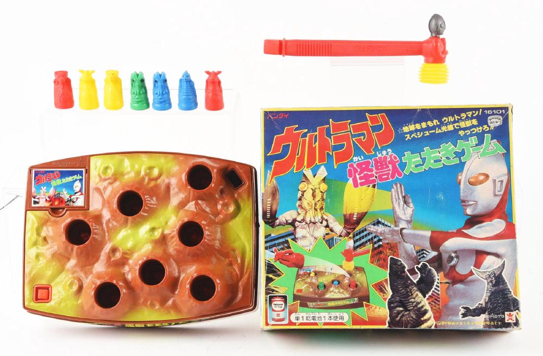 Bandai Ultraman and Enemy "Whack-a-Mole" Game.: Bandai upped the ante form play value and cross branding when they produced this electric "whack-a-mole" style game with Ultra enemies popping up and down. Box art is tremendous, showing Ultraman, Red