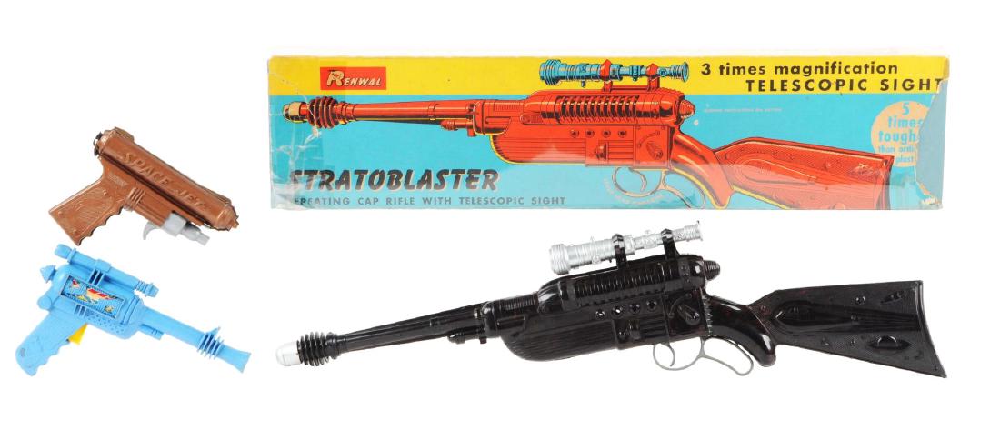 Lot of 3: Renwal Plastic Child's Space Guns.: One has the original box which is a Renwal Stratoblaster Repeating Cap Rifle with telescoping sight. Box is missing a piece on one end and all end flaps. Gun has very little wear. Marked "Renwal" unde