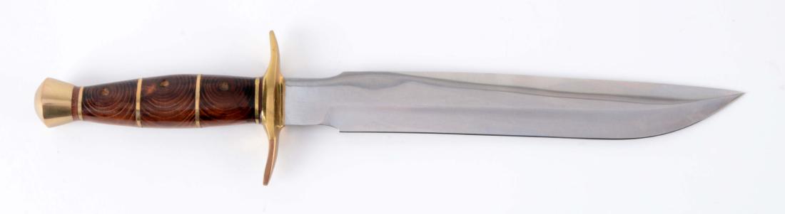 J.N. Cooper Copy of a Randall #1 Style Fighting Knife.: Saber ground clip point blade. Handled in sectioned brown micarta with heavy brass full C-guard and brass pommel. Blade Length: 9-1/2"Overall Length: 14-3/4"
