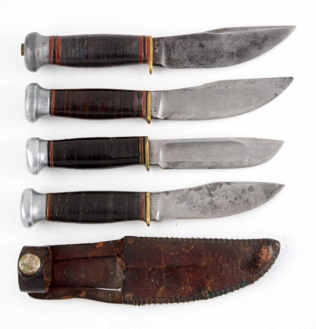 Lot of 4: Marbles Fixed Blades.: Knife A) Woodcraft: Skinner blade with thumb grooved back. No sheath. Knife B) Woodcraft: Skinner blade with thumb grooved back. No sheath. Knife C) Ideal: Clip point with fullers. No sheath. Knife D)